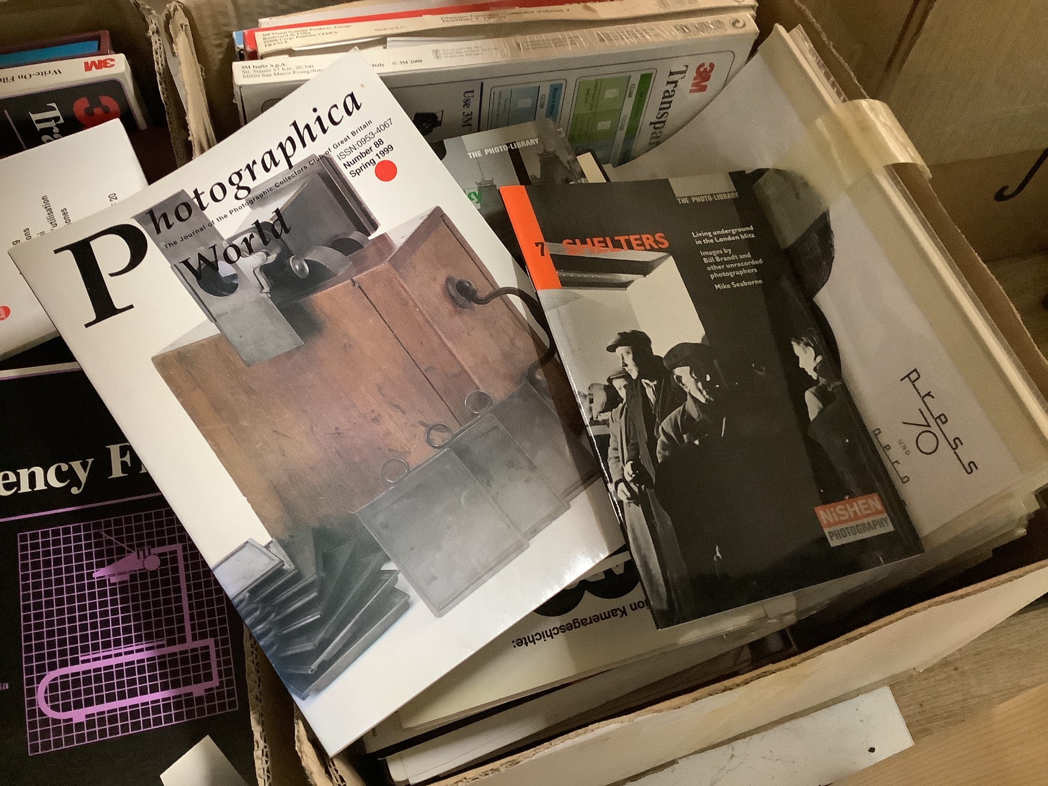 A large and wide-ranging collection of books and other written material relating to photography and cameras, to include various camera manuals, numerous editions of ‘Leica Fotografie’, books on wartime poster design and